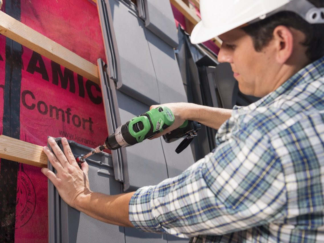 Roofers installing Actua roof tiles