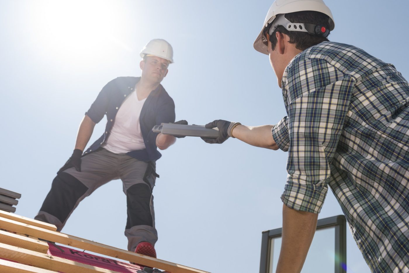 Roofers installing Actua roof tiles